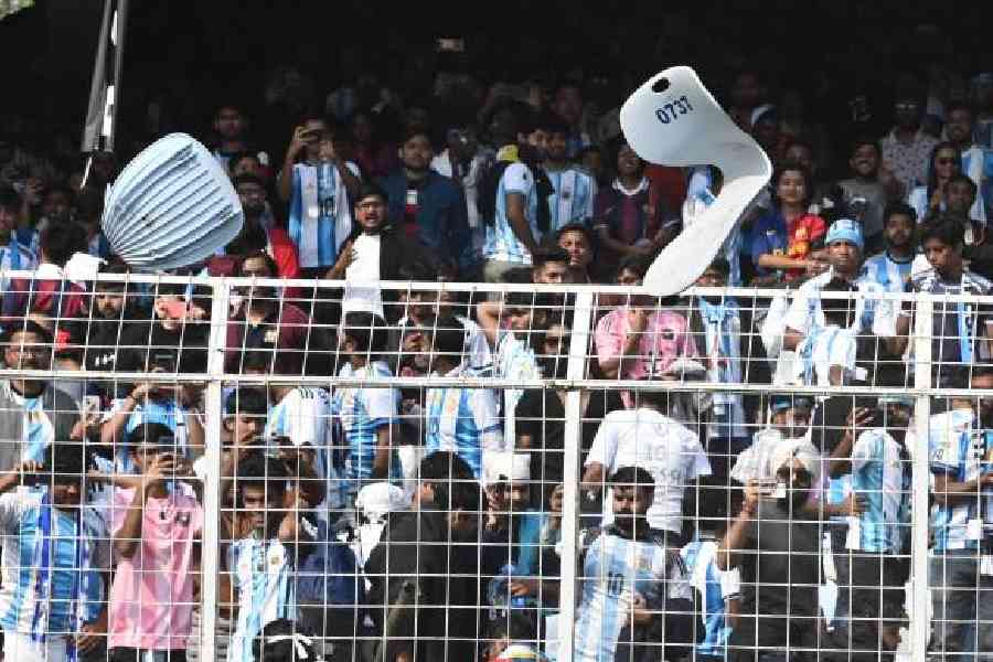 Angry fans hurl broken bucket seats at the Salt Lake Stadium on Saturday. Picture by Sanat Kr Sinha