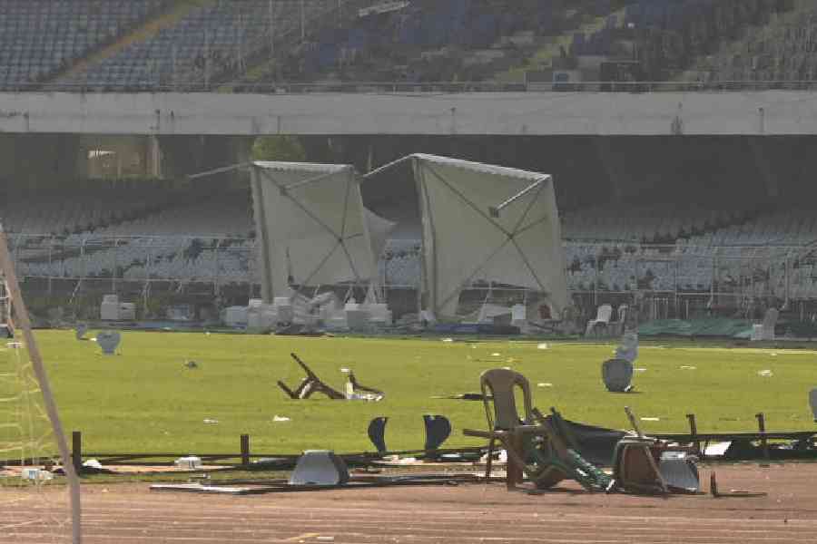 Torn banners and broken seats lie strewn at the Salt Lake Stadium on Monday. Picture by Bishwarup Dutta