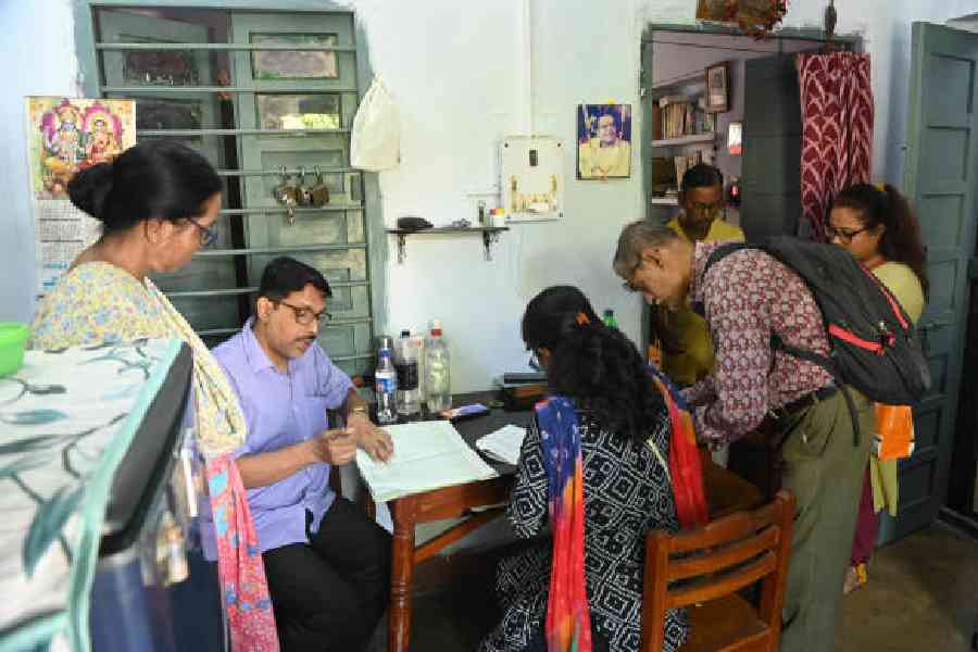 Enumeration forms for the SIR being served at a housing complex in Calcutta. File picture