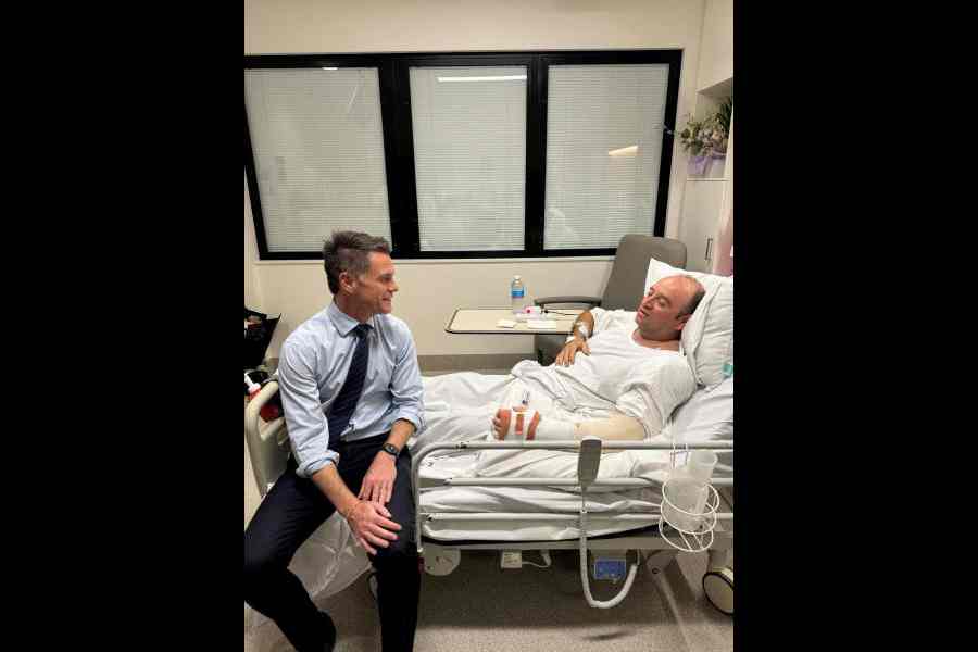 Chris Minns visits Ahmed el Ahmed at a hospital in Sydney on Monday.