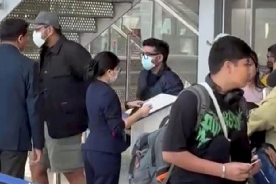 Luthra brothers Saurabh and Gaurav, co-owners of Goa's 'Birch by Romeo Lane' nightclub, detained in Thailand over the deadly club fire, being escorted at the airport ahead of their deportation to India, in Bangkok, Tuesday, Dec. 16, 2025.