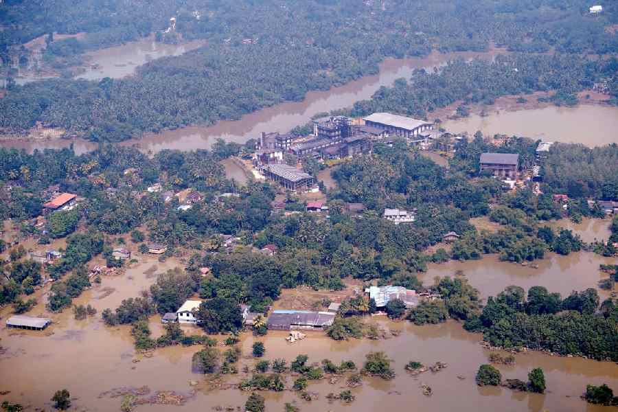 An aerial view of submerged buildings in a flooded area caused by heavy rainfall following Cyclone Ditwah in Niyamgamdora, Sri Lanka
