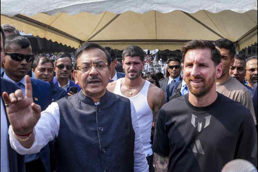 Argentine footballer Lionel Messi with West Bengal Sports Minister Aroop Biswas, right, during an event as part of his 'G.O.A.T. India Tour 2025', at Vivekananda Yuba Bharati Krirangan (VYBK), in Kolkata, Saturday, Dec. 13, 2025.