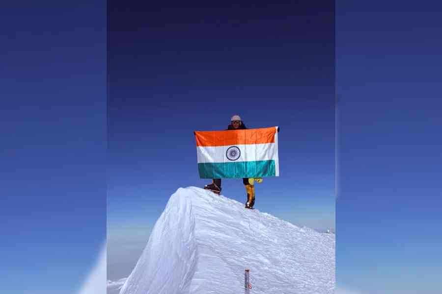 Manita Pradhan with the Indian Tricolour on the peak of Mount Vinson Massif in Antarctica on December 12