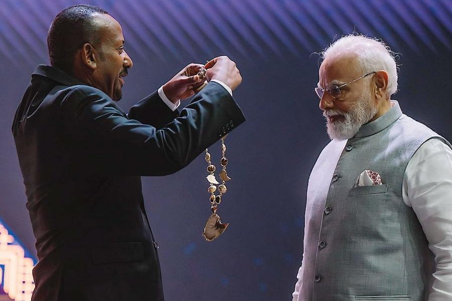 In this image posted on Dec. 17, 2025, Prime Minister Narendra Modi being conferred with Ethiopia's highest award 'The Great Honour Nishan of Ethiopia' by his Ethiopian counterpart Abiy Ahmed Ali during a ceremony at the Addis International Convention Centre, in Addis Ababa.
