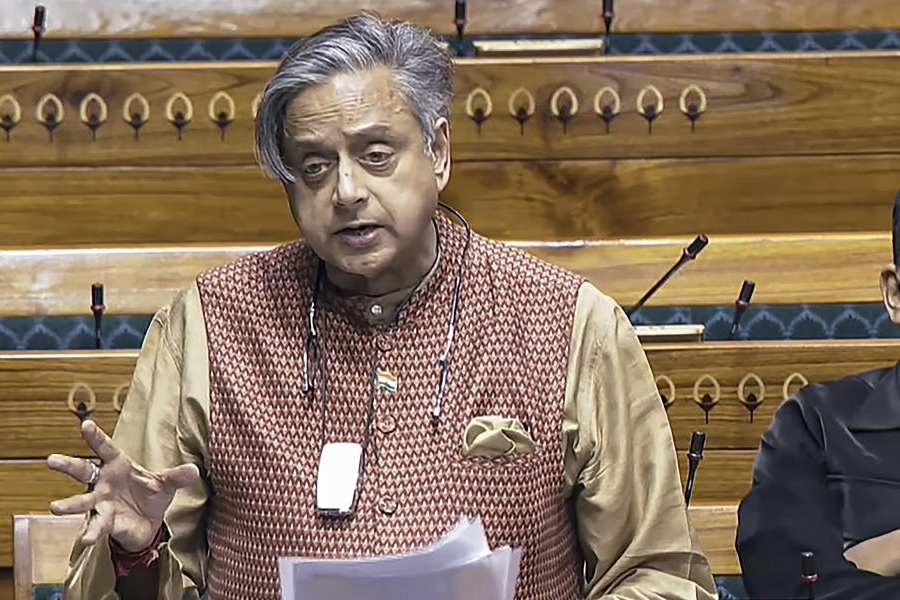 Congress MP Shashi Tharoor speaks in the Lok Sabha during the Winter session of Parliament, in New Delhi, Wednesday, Dec. 17, 2025.