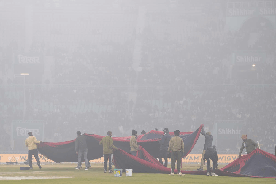 Ground staff members ahead of the fourth T20 International cricket match of a series between India and South Africa, at Ekana Cricket Stadium in Lucknow, Wednesday, Dec. 17, 2025.