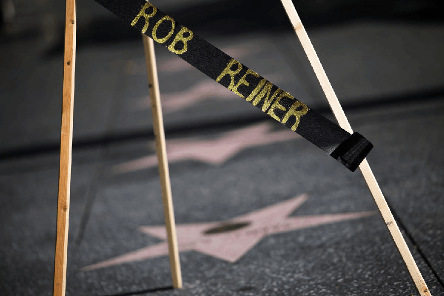 A ribbon bearing Rob Reiner's name is placed on a stand with a wreath at Reiner's star on the Hollywood Walk of Fame after the actor-director and political activist, along with his wife, were found dead, in Los Angeles, California, U.S., December 15, 2025.