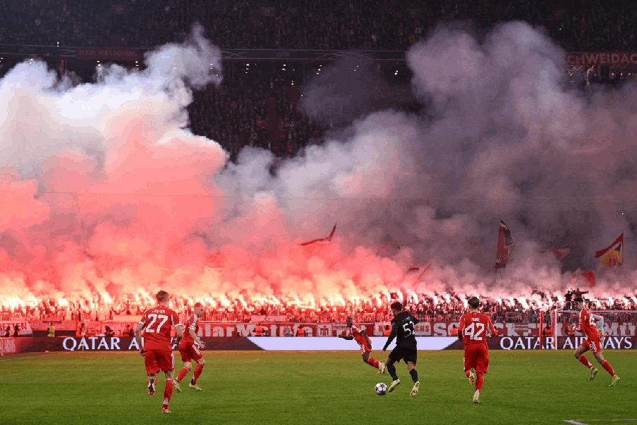Bayern Munich fans are seen with flares and banners in the stands of Allianz Arena, Munich, Germany