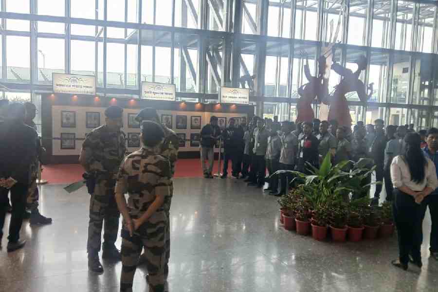 Contractual employees protest in front of the airport manager’s office at gate 3C on the departure level of the terminal on Tuesday