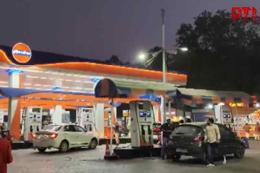 Traffic police personnel stop a vehicle for document verification at the Delhi-Noida Chilla Border, in New Delhi, Thursday, Dec. 18, 2025.