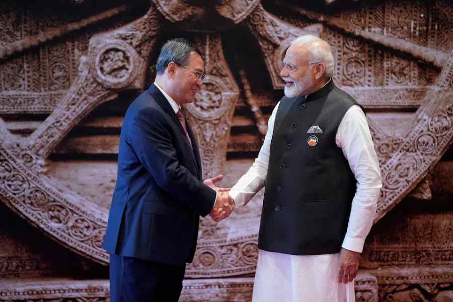 Indian Prime Minister Narendra Modi shakes hand with Chinese Premier Li Qiang upon his arrival at Bharat Mandapam convention centre for the G20 Summit in New Delhi, India, Saturday, Sept. 9, 2023.