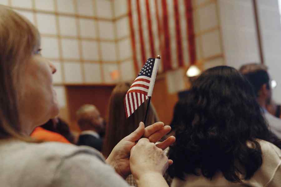 A naturalization ceremony in Boston on Aug. 19, 2025. The Trump administration plans to ramp up efforts to strip some naturalized Americans of their citizenship, according to internal guidance obtained by The New York Times, marking an aggressive new phase in President Trump’s immigration crackdown.