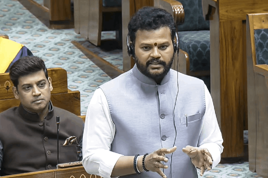 Union Minister Kinjarapu Ram Mohan Naidu speaks in the Lok Sabha during the Winter session of Parliament, in New Delhi, Thursday, Dec. 18, 2025.