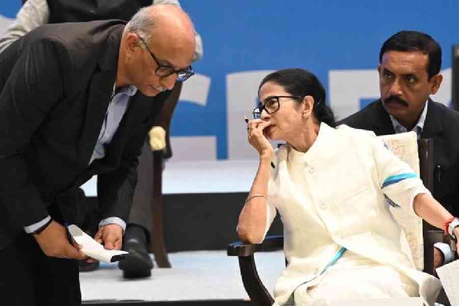Chief minister Mamata Banerjee speaks with chief secretary Manoj Pant during the business conclave at Dhana Dhanye Auditorium in Calcutta on Thursday. Picture by Sanat Kr Sinha