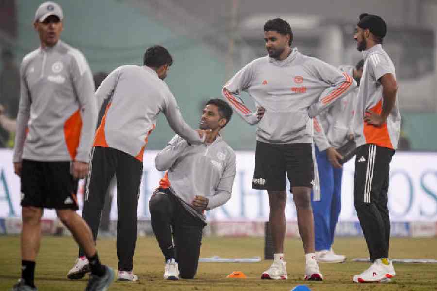 Suryakumar Yadav with teammates in Lucknow on Wednesday, before the fourth T20I was abandoned dueto poor weather conditions. The final game of the series is in Ahmedabad on Friday.
