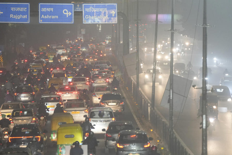Vehicles stuck in a traffic jam as a layer of smog engulfs the city amid deterioration in the capital's air quality, in New Delhi, Thursday, Dec. 18, 2025.