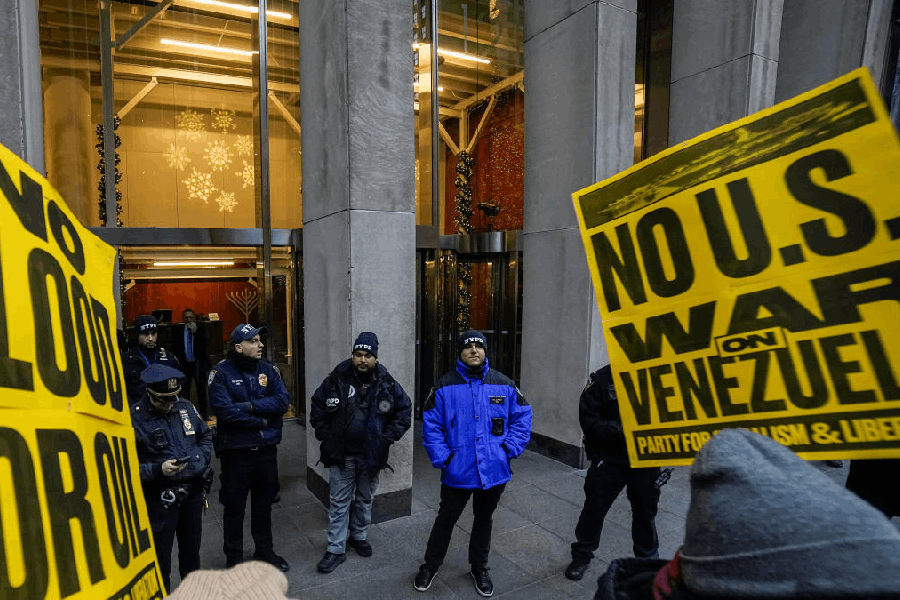 File photo: New York Police Department officers stand guard at News Corporation during an initiative called "National Day of Action: No War on Venezuela," at Times Square in New York City, U.S., December 6, 2025.