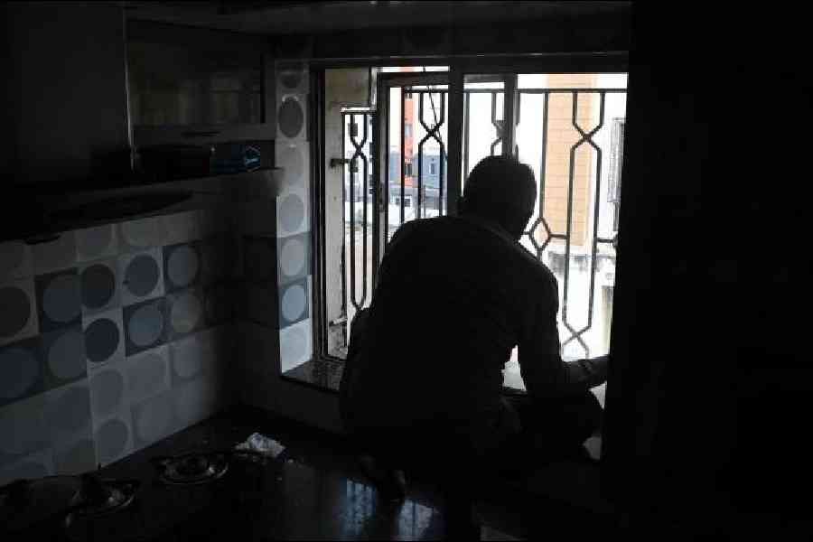A window damaged by an oxygen cylinder in Kankurgachi being repaired on Friday. Picture by Sanat Kr Sinha
