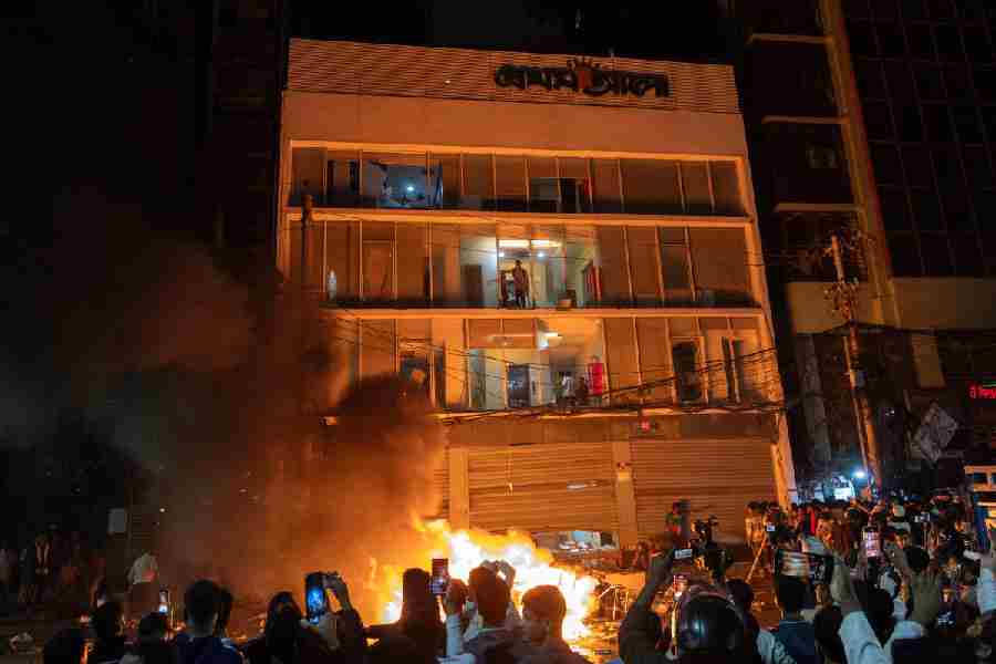 Protesters torch the Prothom Alo office in Dhaka on Thursday night. The newspaper said its edition could not be published for the first time since its launch 27 years ago.