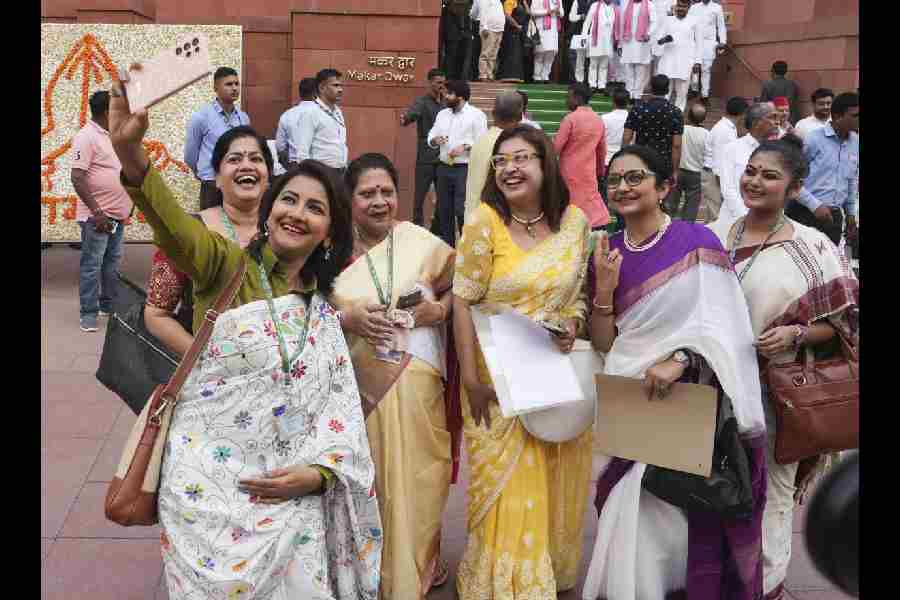 TMC women MPs take selfies at the Parliament House complex during the first session of the 18th Lok Sabha, in New Delhi, Tuesday, June 25, 2024.