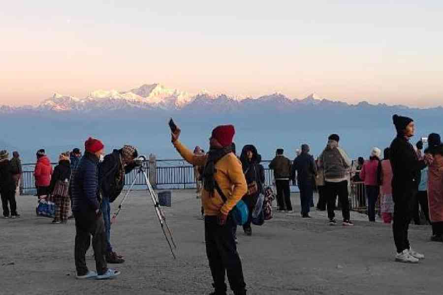 Some of the few tourists who made it to Tiger Hill in Darjeeling on Friday morning