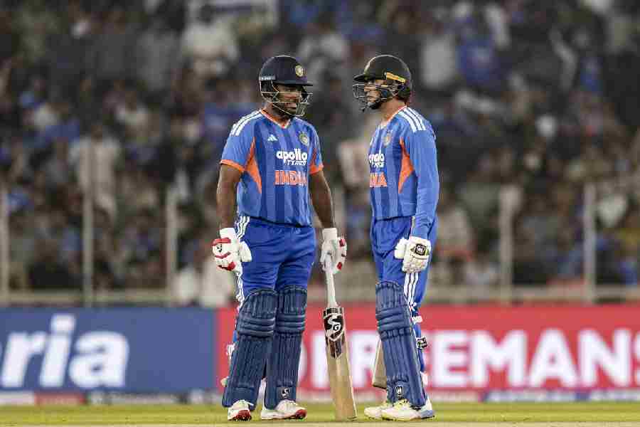 India's Sanju Samson, left, and Abhishek Sharma interact during the fifth T20 International cricket match of a series between India and South Africa, at Narendra Modi Stadium in Ahmedabad.