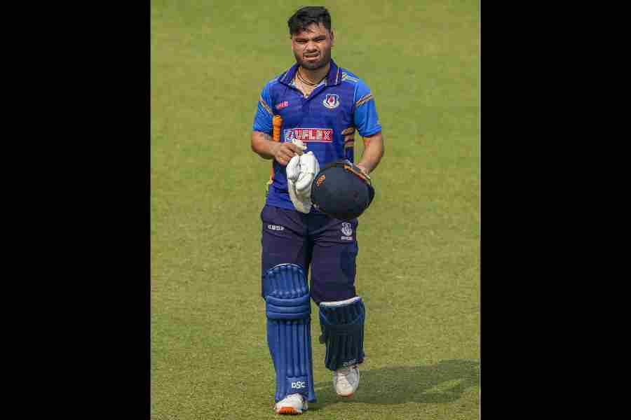 Uttar Pradesh's Rinku Singh returns to the pavilion after his dismissal by Chandigarh’s Sandeep Sharma during a Syed Mushtaq Ali Trophy 2025 cricket match between Uttar Pradesh and Chandigarh