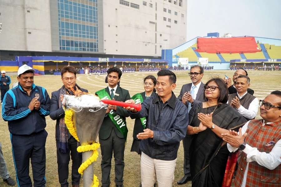 Bhaichung Bhutia lights the torch to declare the DPS Ruby Park sports day open at Gitanjali Stadium