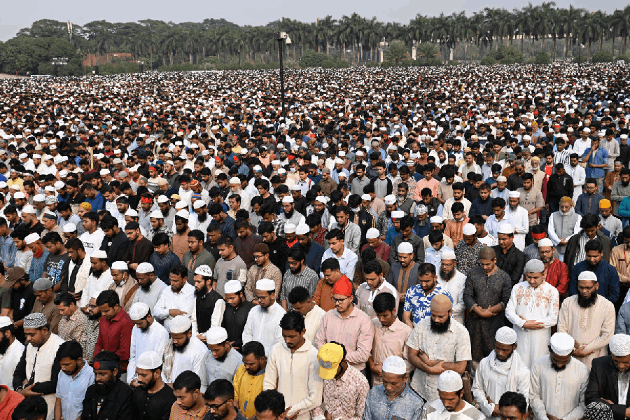 Thousands of people offer funeral prayers for leading Bangladeshi activist Sharif Osman Hadi, who died from gunshot wounds sustained in an attack in Dhaka earlier this month, outside the nation's Parliament complex in Dhaka, Bangladesh, Saturday, Dec. 20, 2025.