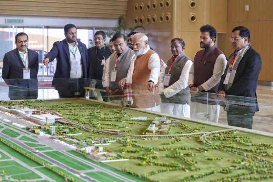 Prime Minister Narendra Modi, Assam chief minister Himanta Biswa Sarma and other dignitaries during the inauguration of a new terminal of the Lokapriya Gopinath Bardoloi International Airport in Guwahati on Saturday. 