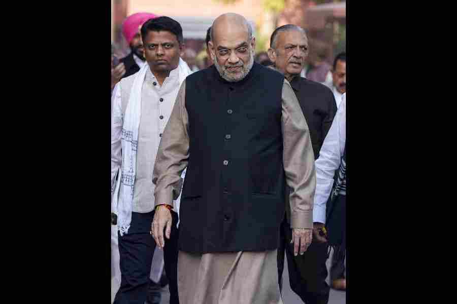 Union Home Minister Amit Shah during the Winter session of Parliament, in New Delhi, Tuesday, Dec. 9, 2025.
