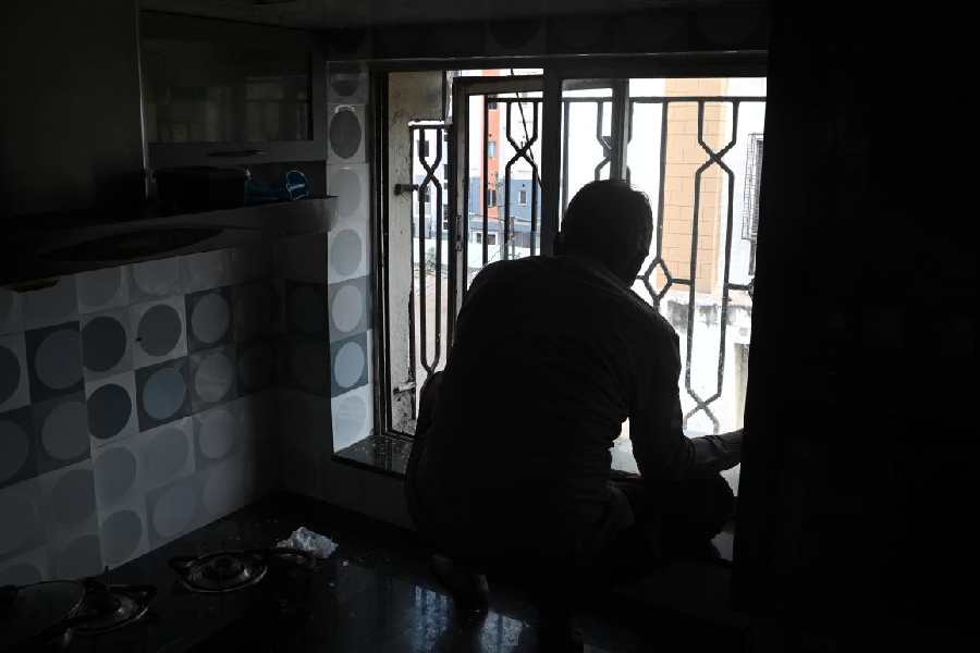 A window damaged by an oxygen cylinder in Kankurgachi being repaired on Friday.