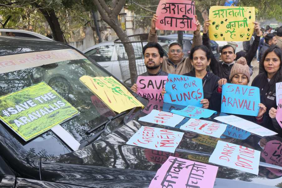 Members of 'Aravalli Bachao Sanstha' stage a demonstration as part of the Save Aravalli movement, near the residence of Haryana minister Rao Narbir Singh, in Gurugram, Saturday, Dec. 20, 2025.