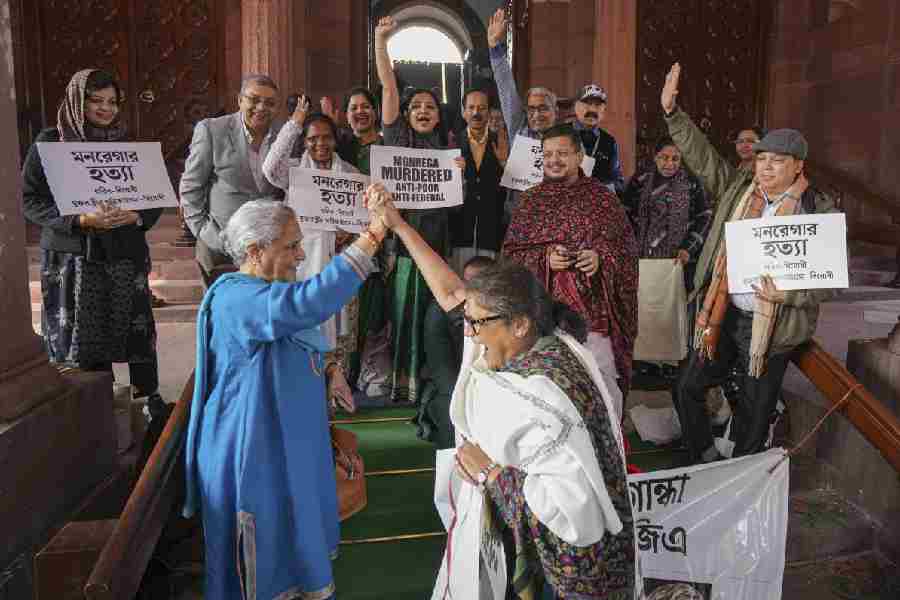 The Samajwadi Party’s Jaya Bachchan (in blue) and Trinamool’s Sushmita Dev (background, from left) with her party colleagues Mausam Noor, Kalyan Banerjee, June and others at an Opposition protest against the RAM G bill outside Parliament on December 19.