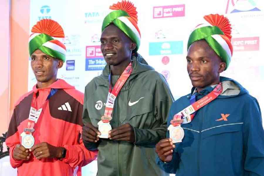Winners of the international elite men’s section: (from left) Alphonce Felix Simbu (second), Joshua Cheptegei (first), and Tebello Ramakongoana (third)
