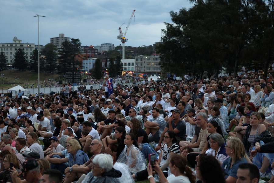 People attend the 'Light Over Darkness' vigil honouring victims and survivors of the deadly mass shooting during a Jewish Hanukkah celebration at Bondi Beach on December 14