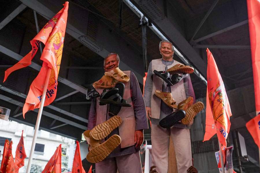 Members of Hindu outfits, under the leadership of LoP in the West Bengal Assembly and BJP leader Suvendu Adhikari, unseen, stage a demonstration to protest the killing of a Bengali Hindu in Bangladesh, near the Bangladesh Deputy High Commission, in Kolkata, Monday, Dec. 22, 2025.