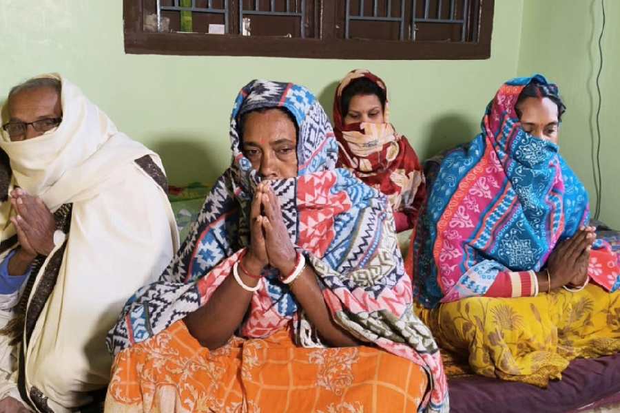 Kanai Chandra Sarkar (left) with some of his family members at their relative’s place in Talpara of Old Malda police station area in Malda district 