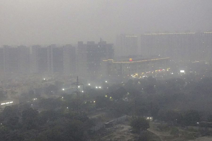 A layer of smog engulfs Delhi-NCR, during a cold winter evening, Monday, Dec. 22, 2025.