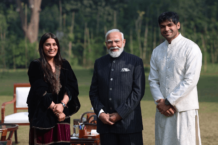 PM Narendra Modi with India's double Olympic medallist Neeraj Chopra and wife Himani Mor, Tuesday, 23 December 2025.