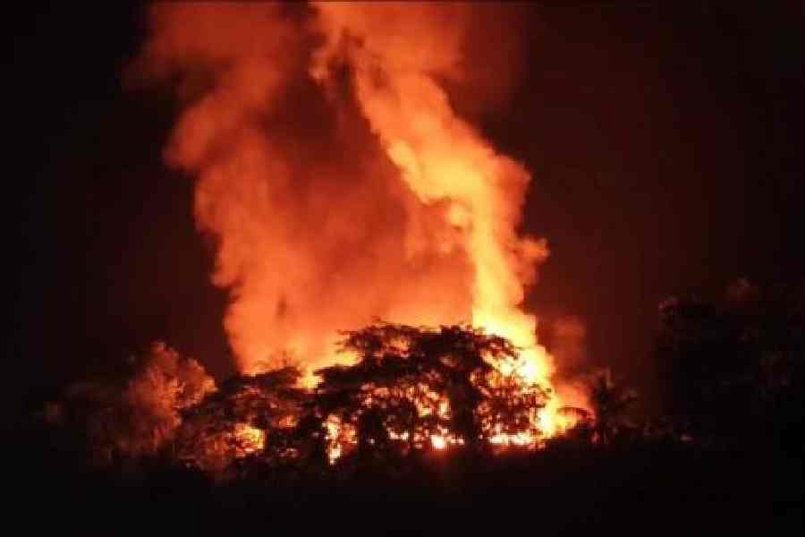 The Kheroni market set ablaze by protesters in West Karbi Anglong, Assam, on Tuesday evening