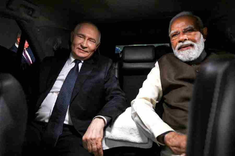 Russian President Vladimir Putin and Indian Prime Minister Narendra Modi sit in a car during a welcoming ceremony at the Palam Air Base in New Delhi, India December 4, 2025.