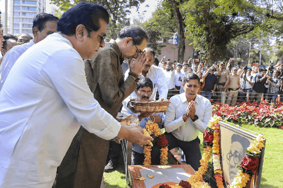 In this image posted on Dec. 24, 2025, Maharashtra Navnirman Sena (MNS) chief Raj Thackeray, front, and Shiv Sena (UBT) chief Uddhav Thackeray pay tributes at the memorial of Shiv Sena founder Bal Thackeray at Shivaji Park as their parties announce alliance ahead of Mumbai civic polls.