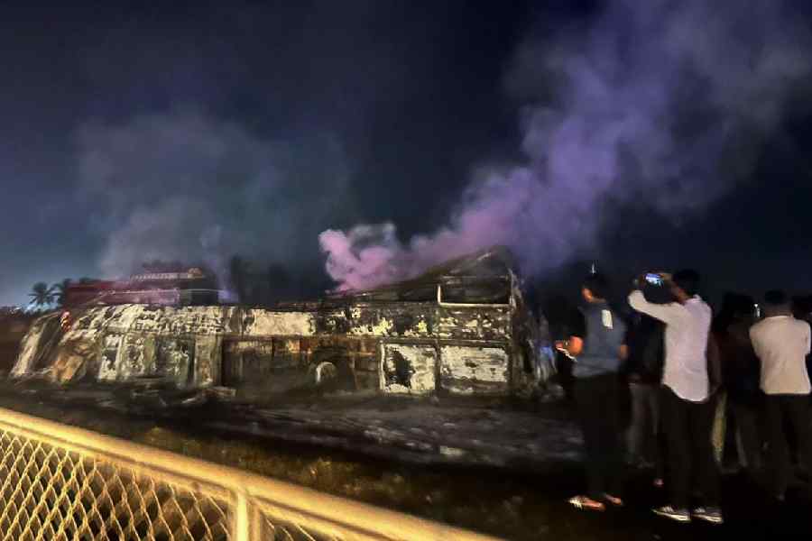 Charred remains of a bus after it caught fire following a collision with a speeding truck, in Chitradurga, early Thursday, 25 December, 2025.