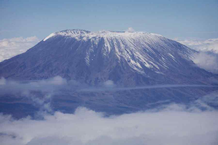 A fresh dusting of snow sits atop the dormant volcano of Mount Kilimanjaro, Africa's highest peak, in northern Tanzania, November 22, 2007.