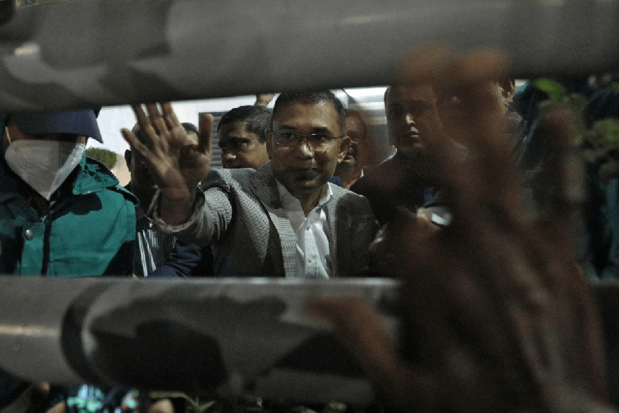 Bangladesh Nationalist Party (BNP) acting chairman Tarique Rahman waves as he arrives at Evercare Hospital to meet his ailing mother and former Prime Minister Khaleda Zia, in Dhaka, Bangladesh, December 25, 2025.