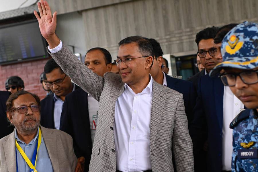 Bangladesh Nationalist Party (BNP) Acting Chairman, Tarique Rahman, waves to supporters at Hazrat Shahjalal International Airport in Dhaka after returning from London, ending more than 17 years of self-imposed exile, Thursday, Dec. 25, 2025.