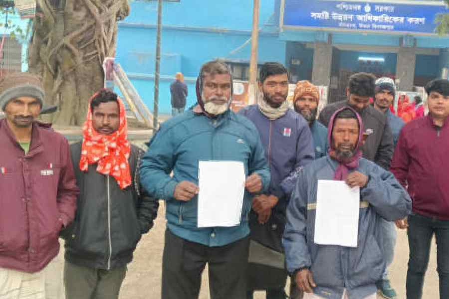Villagers facing social boycott in front of the Itahar BDO office in North Dinajpur on Wednesday. Picture by Kousik Sen
