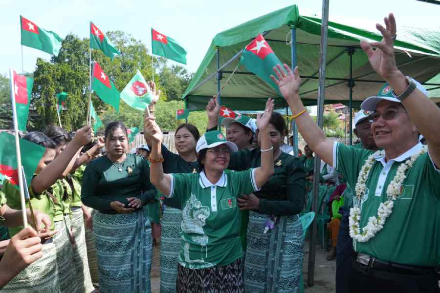 Supporters of the military-backed Union Solidarity and Development Party (USDP) dance during election campaign in Pyawbwe Township, Mandalay Division, central Myanmar, Thursday, Dec. 25, 2025.